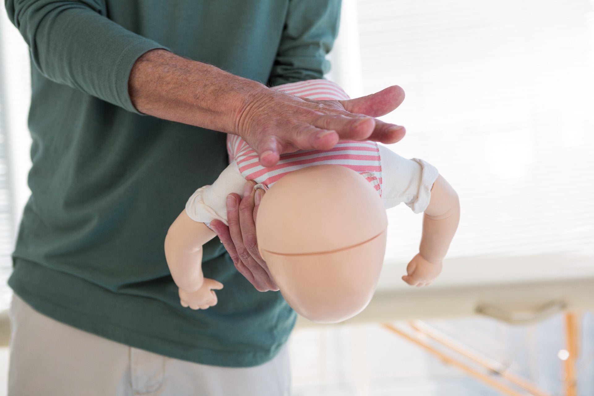 First aid treatment for choking baby - ComplyPlus™ - The Mandatory Training Group UK -
