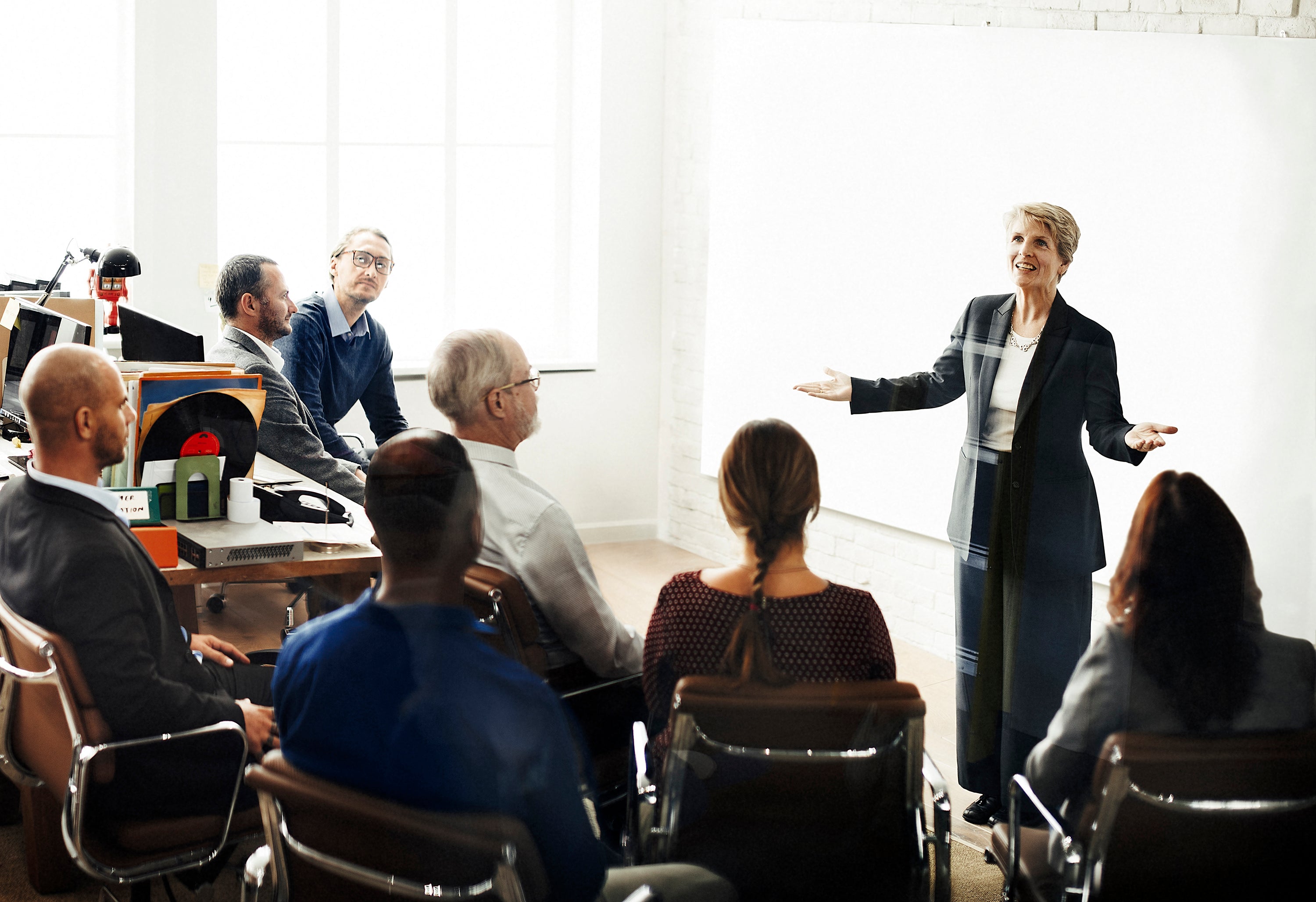 Trainer leading workplace learning session with colleagues - ComplyPlus™ - The Mandatory Training Group UK -